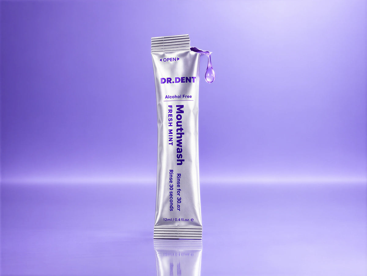 DR.DENT Purple Mouthwash sachet being torn open at the sink