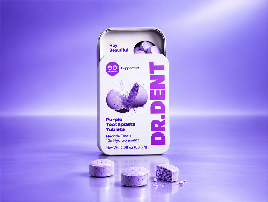 DR.DENT Purple Toothpaste Tablet next to a toothbrush